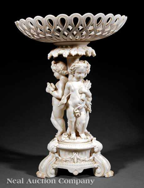 Appraisal: An Antique Continental Parian Figural Compote th c reticulated basket