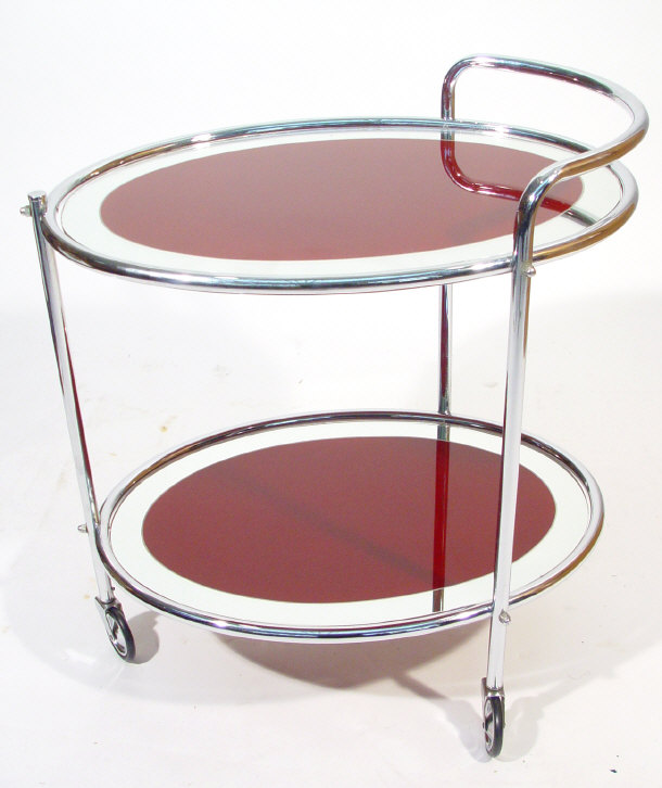 Appraisal: s chrome framed two tier tea trolley set with oval