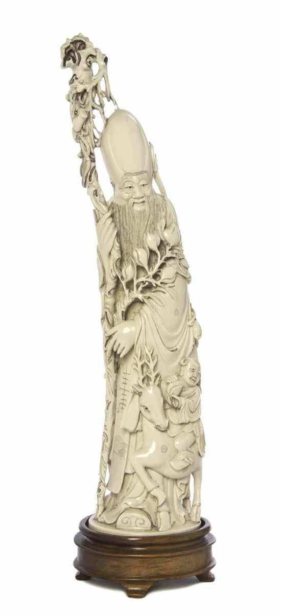 Appraisal: An Ivory Model of Shoulao depicting the figure with an