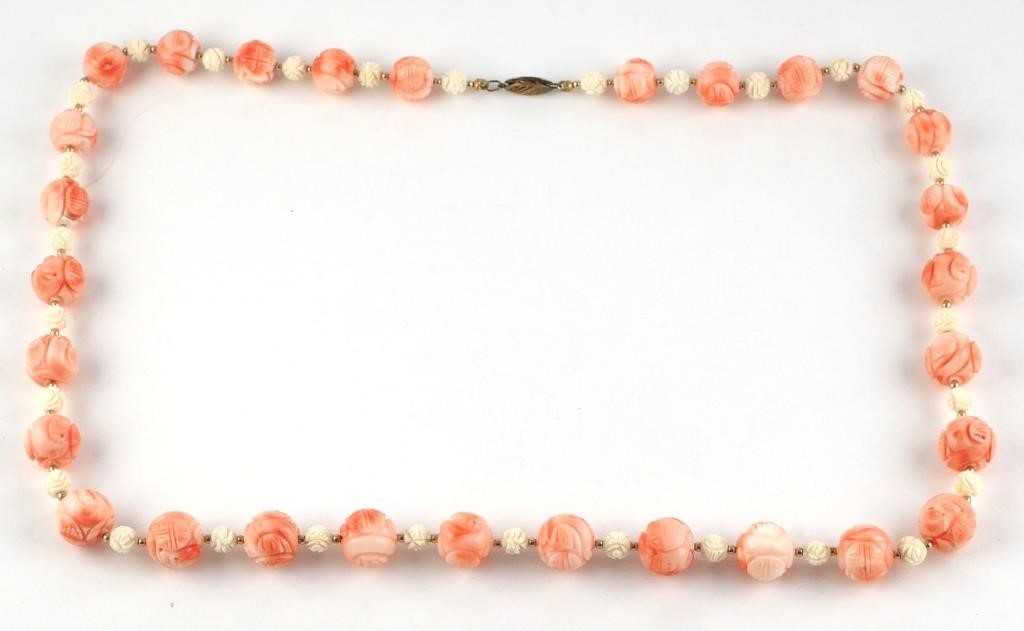 Appraisal: Vintage carved coral ball bead necklace each carved with the