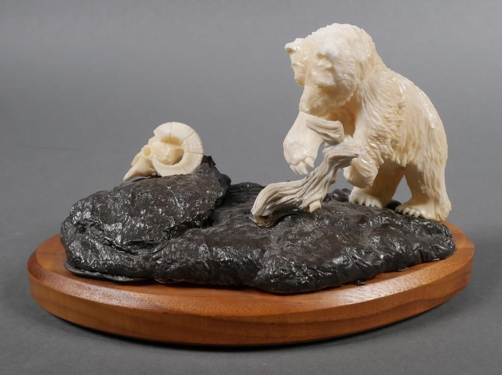 Appraisal: Mammoth bone ivory sculpture of Kodiak bear on rock Signed