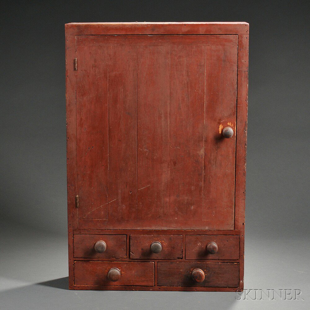 Appraisal: Red-painted Wall Cupboard New England early th century the hinged