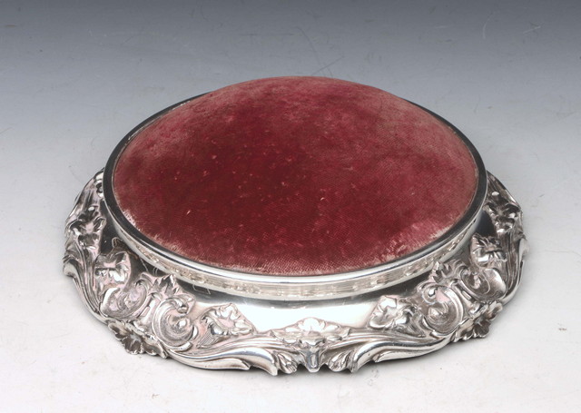 Appraisal: A LARGE TABLE TOP WHITE METAL MOUNTED RED VELVET SILK