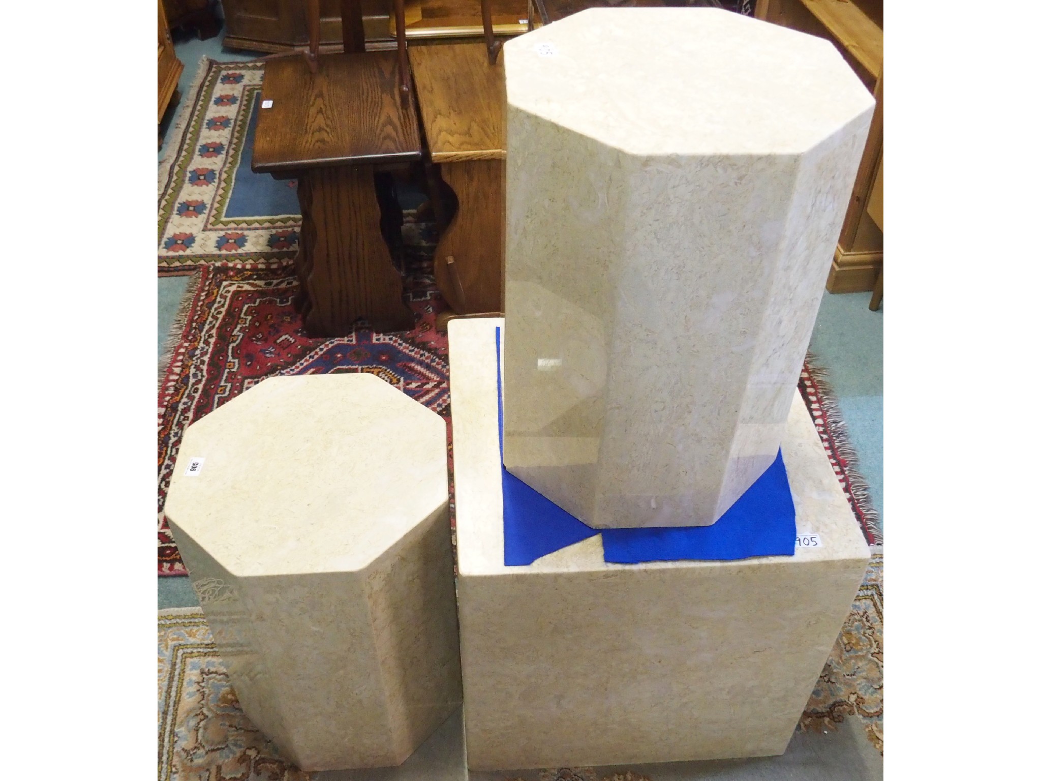 Appraisal: Two octagonal and a square marble plinths