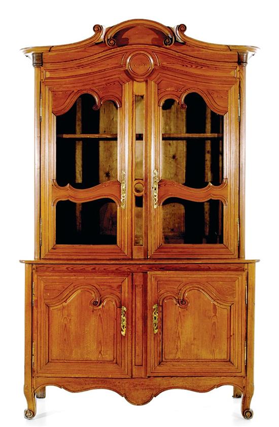 Appraisal: French Provincial pine vaisselier late th century arched and scrolled