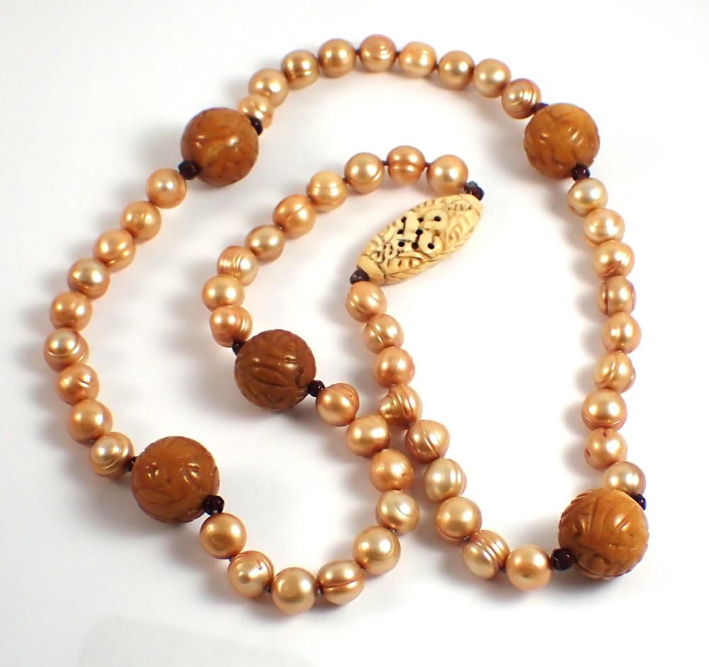 Appraisal: CARVED BONE PEARL AND GARNET BEAD NECKLACE - hand-knotted strand