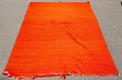 Appraisal: A hand woven Bedouin camel hair rug in vivid orange