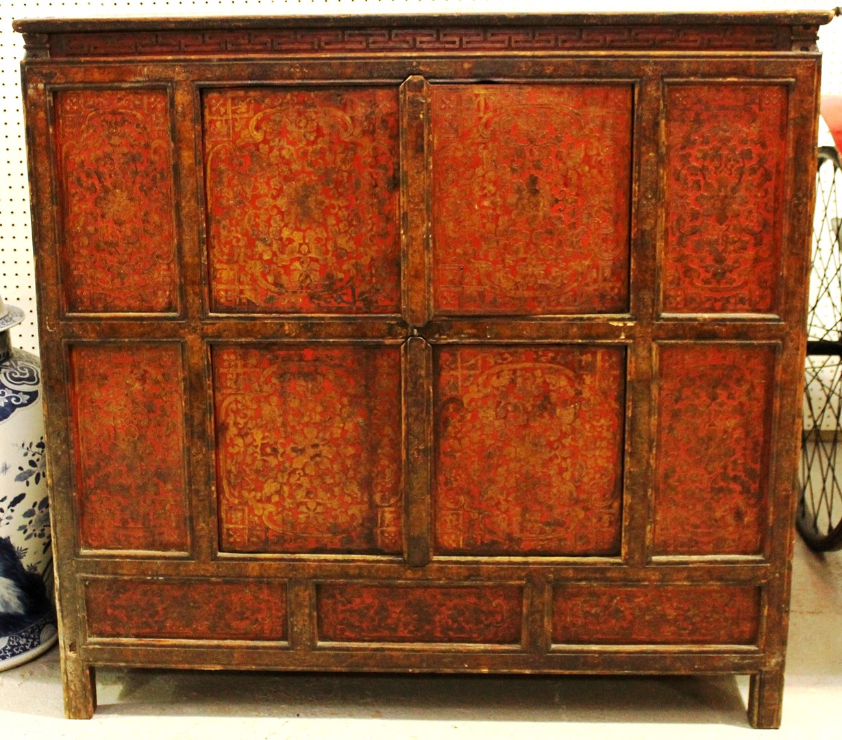 Appraisal: A th century Eastern green and red lacquered side cabinet