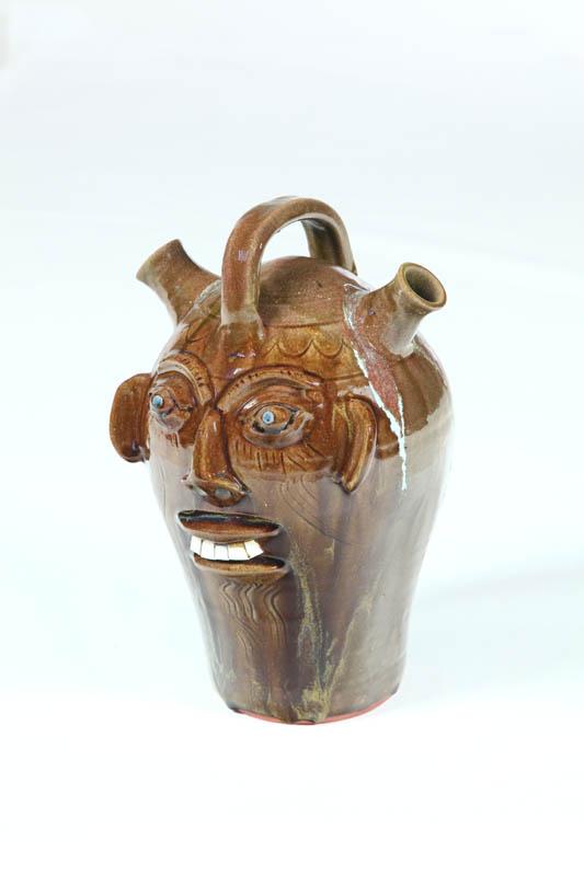 Appraisal: GROTESQUE JUG American th century redware Double spout with single