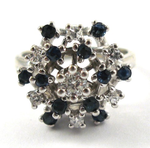 Appraisal: SAPPHIRE DIAMOND AND WHITE GOLD RING The white gold cluster