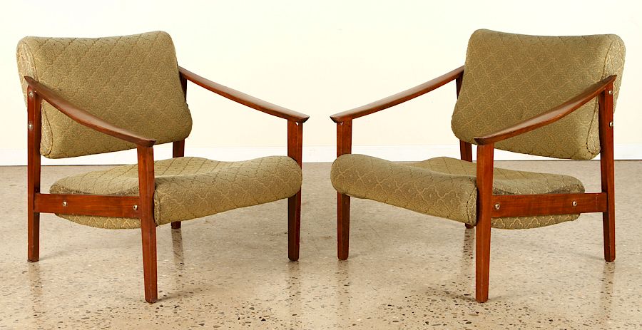 Appraisal: PAIR ARM CHAIRS IN THE MANNER OF FINN JUHL C