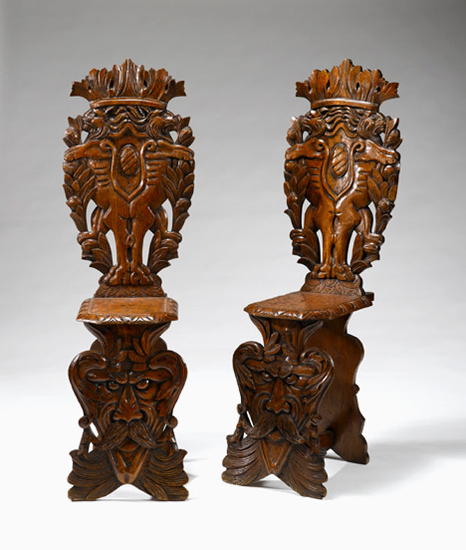 Appraisal: Pair of Baroque style Italian carved oak hall chairs Each