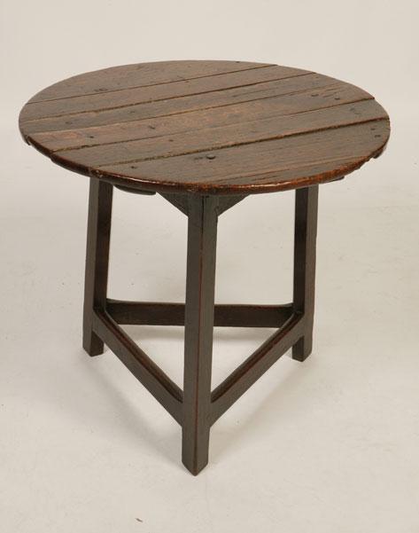 Appraisal: AN TH CENTURY OAK CRICKET TABLE the circular plank construction