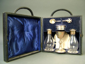 Appraisal: A George VI silver cased travelling communion set London comprising