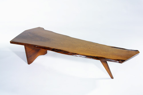 Appraisal: GEORGE NAKASHIMA Walnut Slab coffee table s with heavily-figured freeform