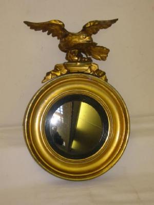 Appraisal: A SMALL REGENCY CONVEX WALL MIRROR the gilded and moulded