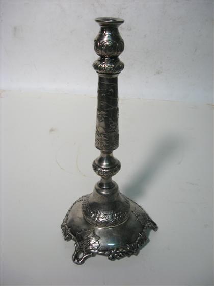 Appraisal: A large silverplate candlestick With overall relief leaf and grape