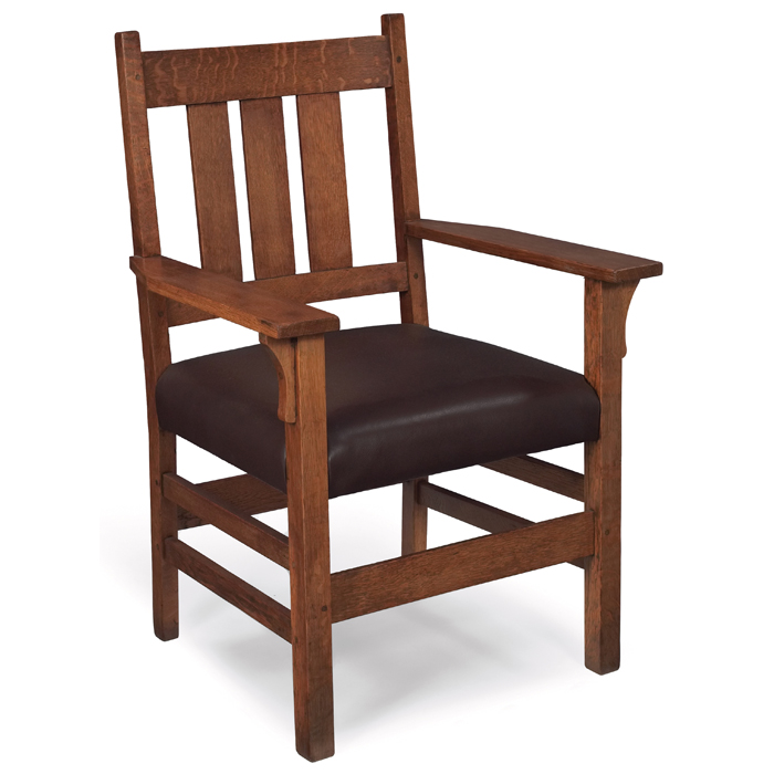 Appraisal: Gustav Stickley armchair threevertical slats at back over a recoveredleather