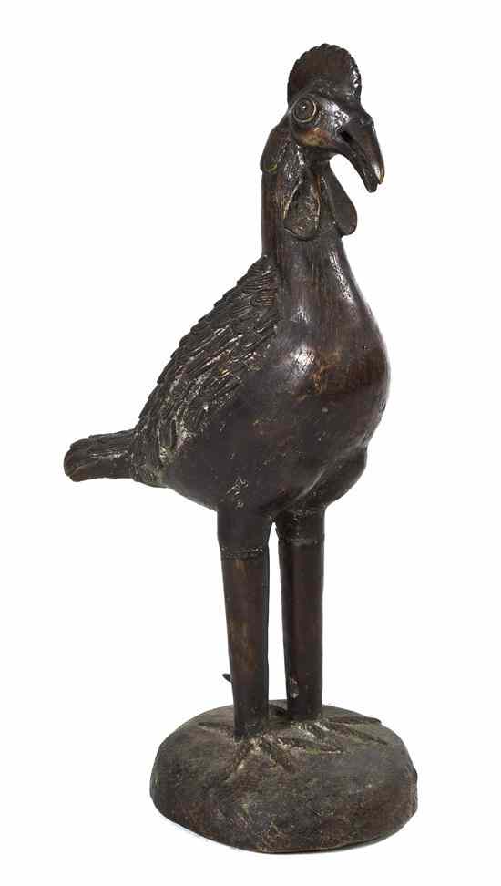 Appraisal: An African Bronze Figure of a Rooster depicted standing raised