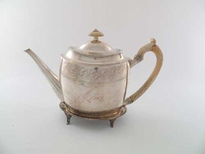 Appraisal: A George III bright engraved oval teapot with an ivory