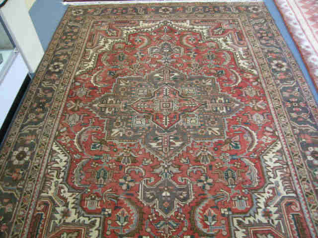 Appraisal: Heriz Persian Handmade Room Size Rug elaborate medallion earthtones '