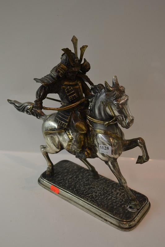 Appraisal: CAST IRON CHROMED AND GILDED ASIAN WARRIOR FIGURE