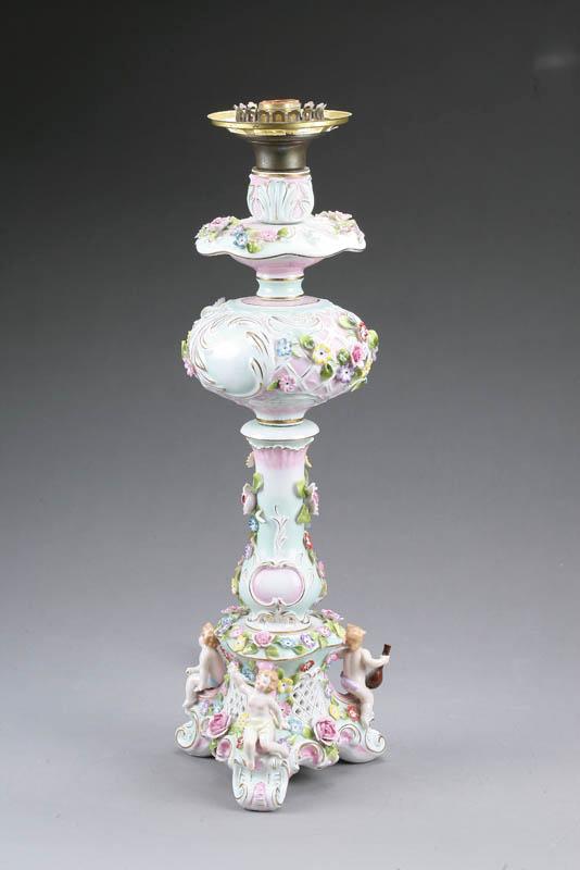 Appraisal: GERMAN PORCELAIN KEROSENE LAMP Ornately decorated with flowers and cherubs