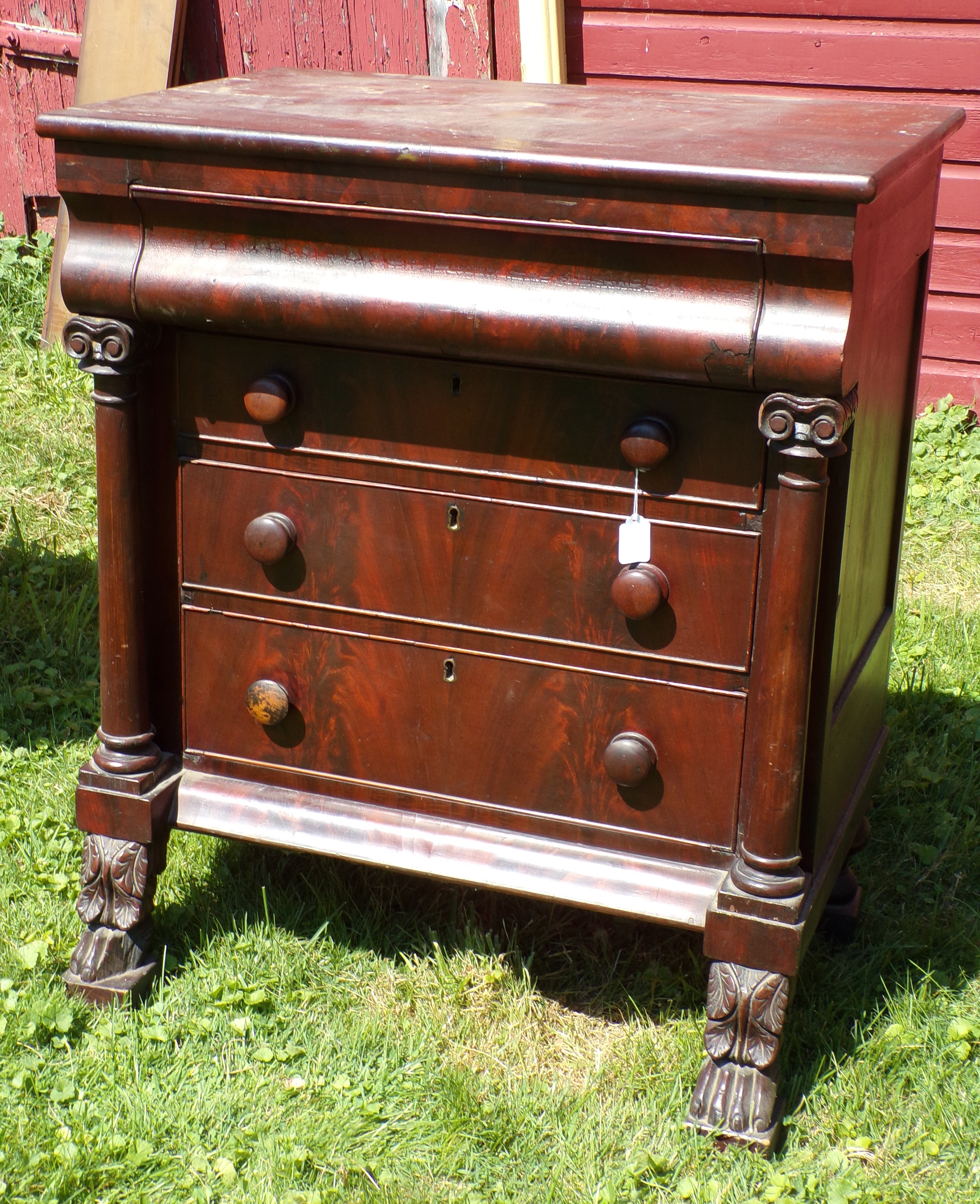 Appraisal: Empire mahogany drawer chest convex top drawer over drawers Ionic