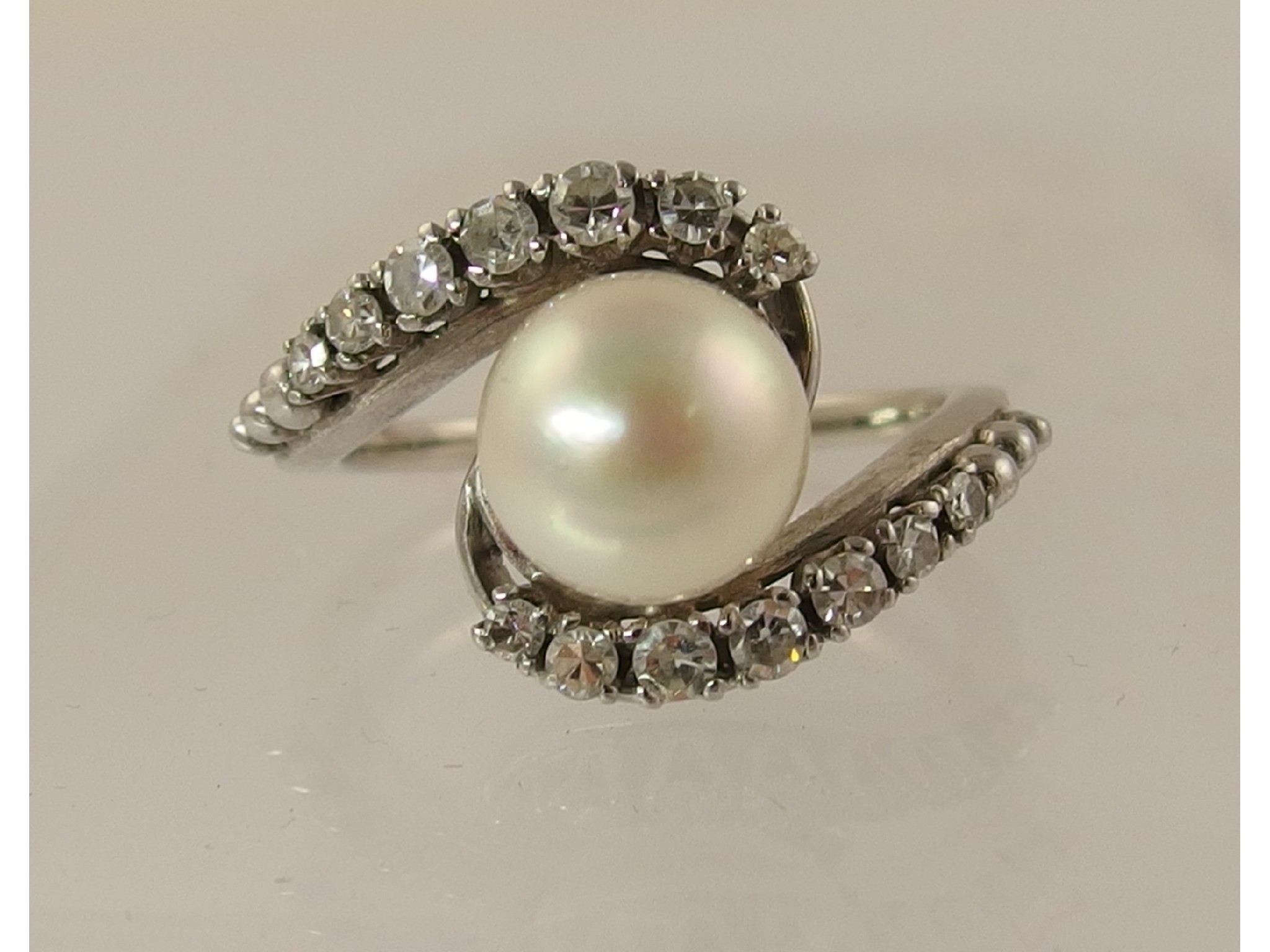 Appraisal: A white metal diamond and pearl ring diamonds approx cts