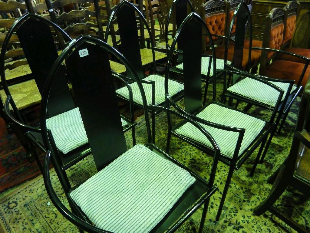 Appraisal: A set of six contemporary tubular steel framed elbow chairs