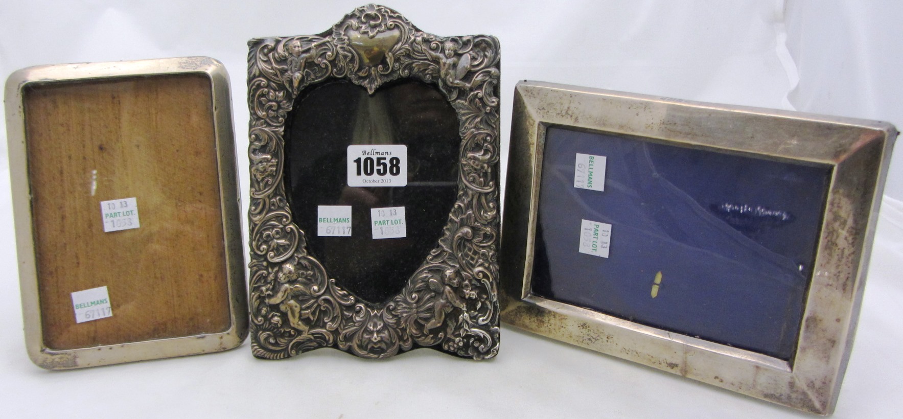 Appraisal: A Victorian silver mounted photograph frame embossed with cherubs and