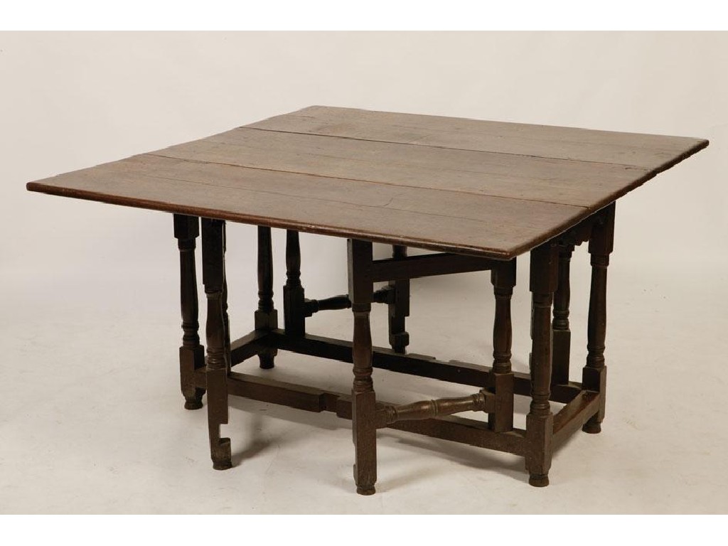 Appraisal: A GEORGE I OAK DROP FLAP DINING TABLE the rectangular