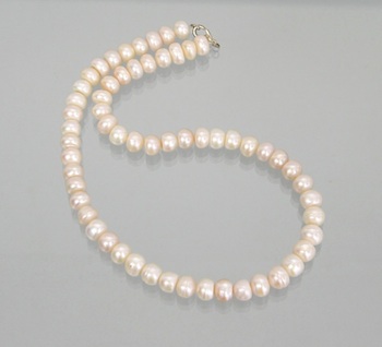 Appraisal: A String of - mm Button Pearls Non-knotted containing button-shape