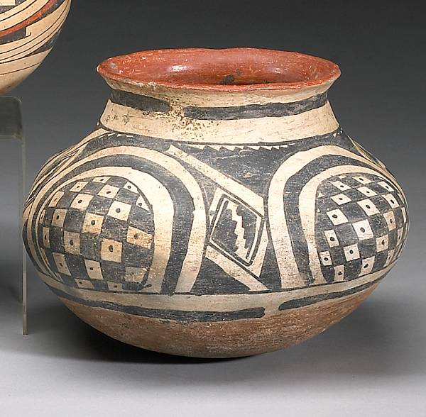 Appraisal: A Gila polychrome lobed jar On a rounded base the