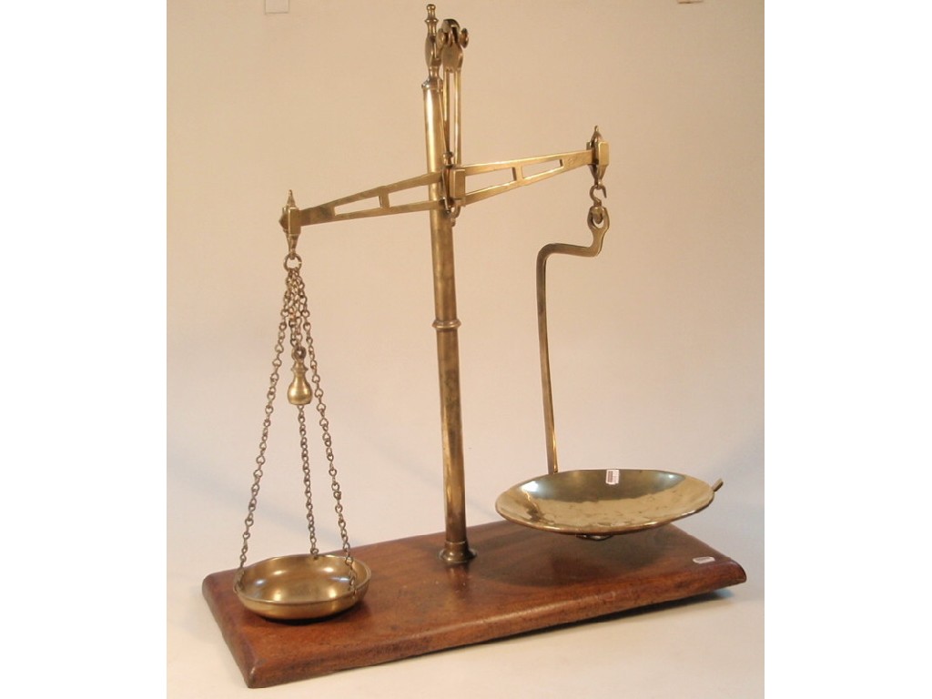 Appraisal: A set of brass Avery balance scales on a mahogany