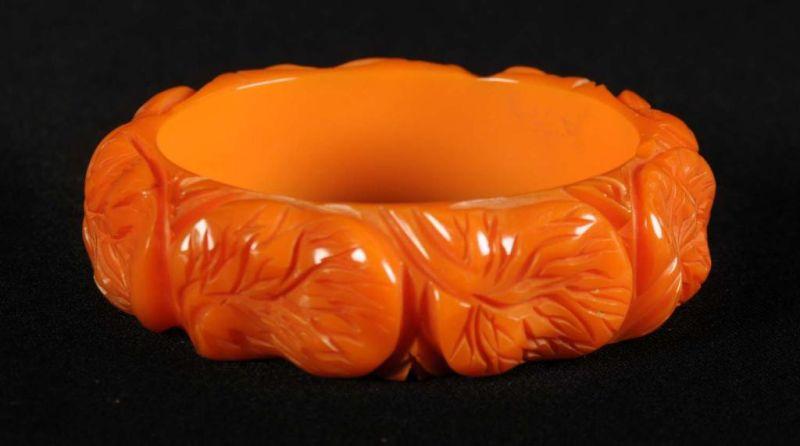 Appraisal: Bakelite Orange Deeply Carved Lilly Pad Bracelet Description Rare Condition