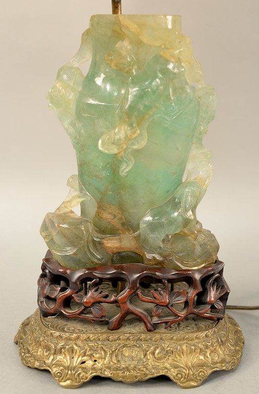 Appraisal: Green quartz urn having carved animals on carved base and