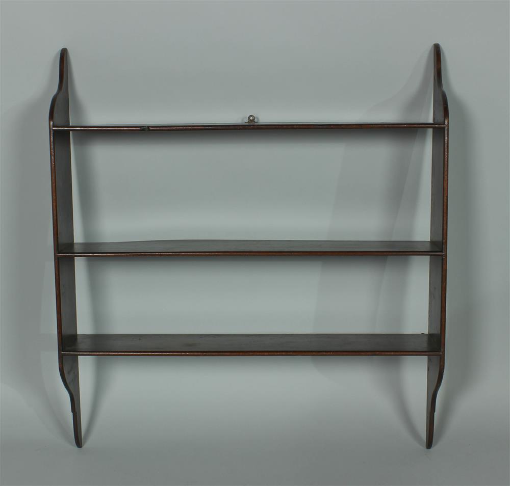 Appraisal: HANGING MAHOGANY WALL SHELF th Century having three shelves with