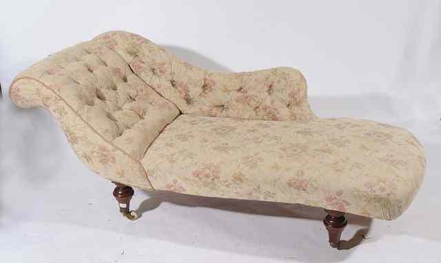 Appraisal: A VICTORIAN CHAISE LONGUE with button upholstered scrolling side and