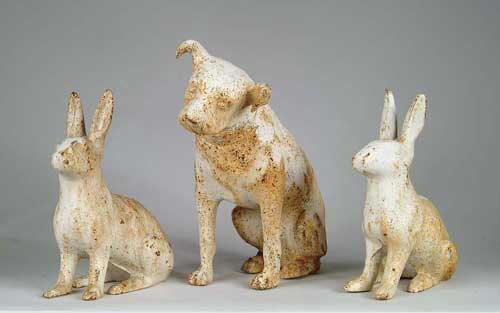 Appraisal: PAIR OF CAST IRON RABBITS AND CAST IRON DOG The