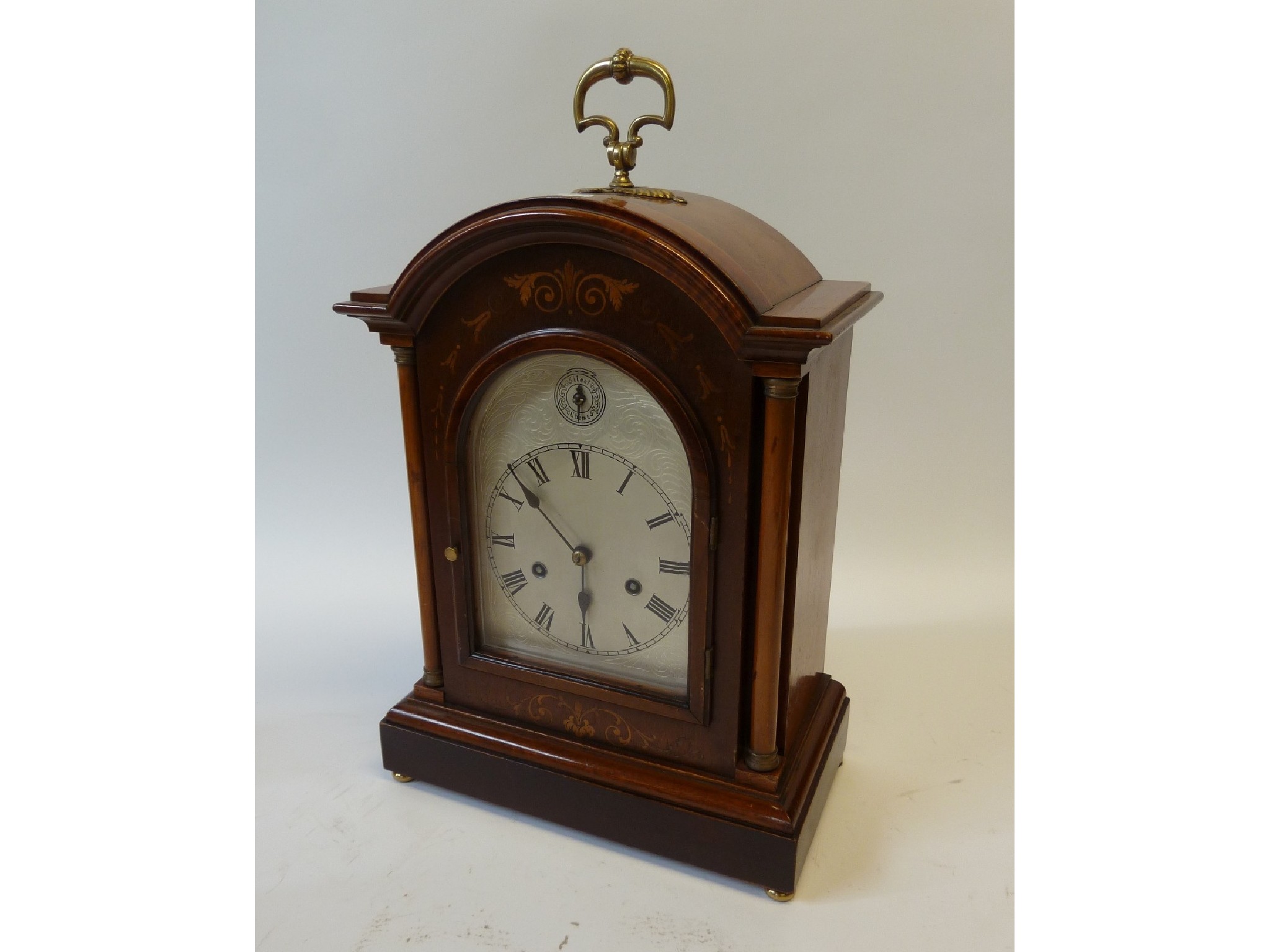 Appraisal: EDWARDIAN MARQUETRY INLAID MAHOGANY BRACKET CLOCK the silvered roman dial