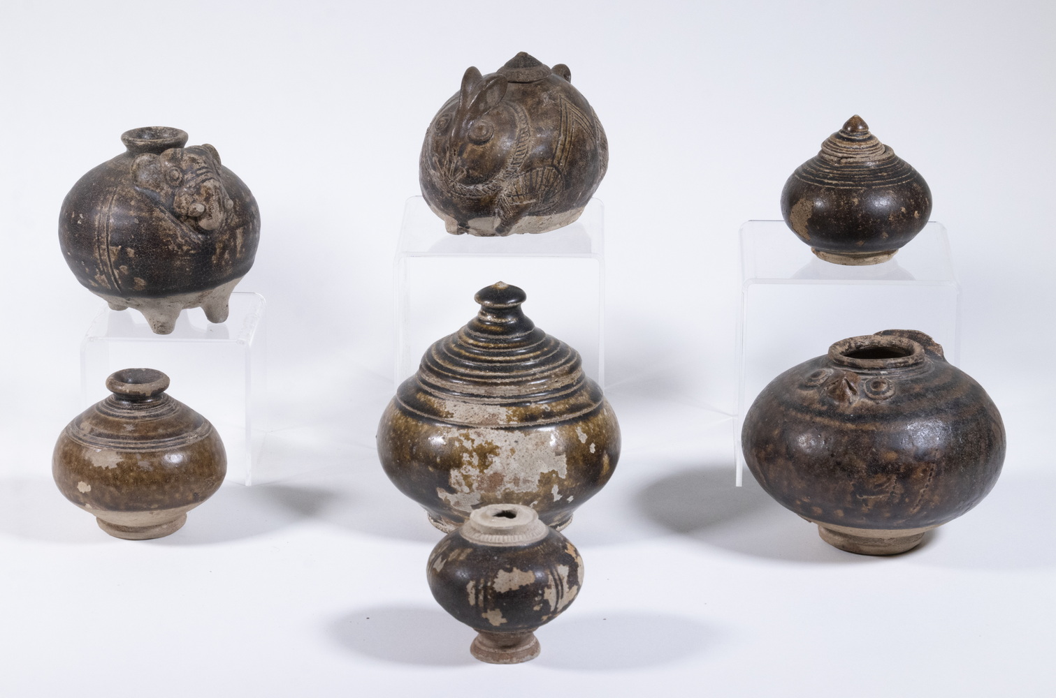 Appraisal: EARLY KHMER BROWN GLAZED STONEWARE Pieces of th- th c