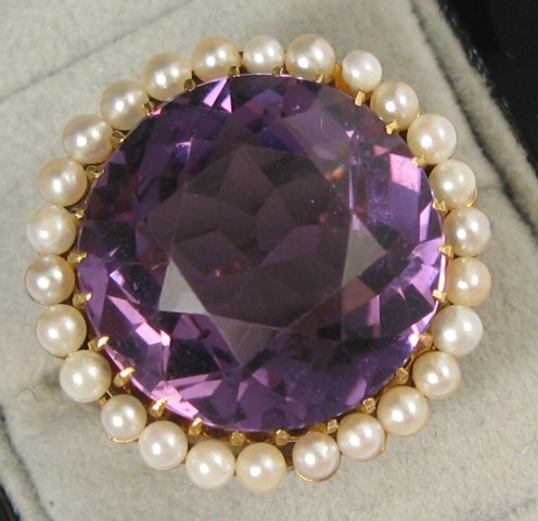 Appraisal: AMETHYST AND SEED PEARL RING k yellow gold centering a