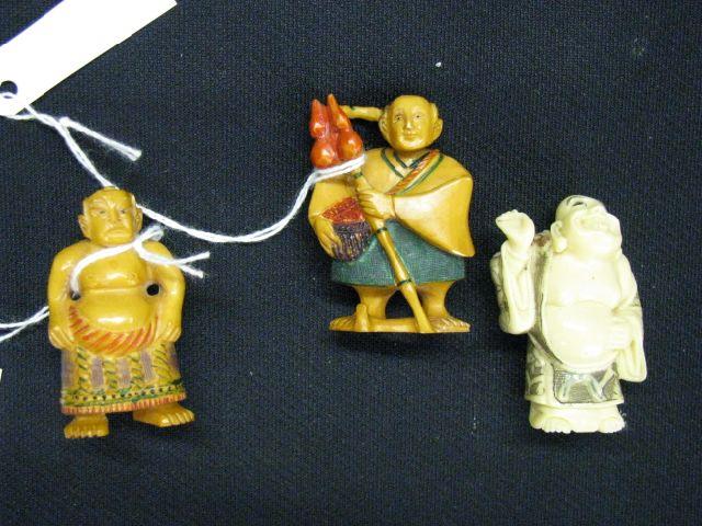 Appraisal: Ivory Netsuke two men with polychrome details and brown tea