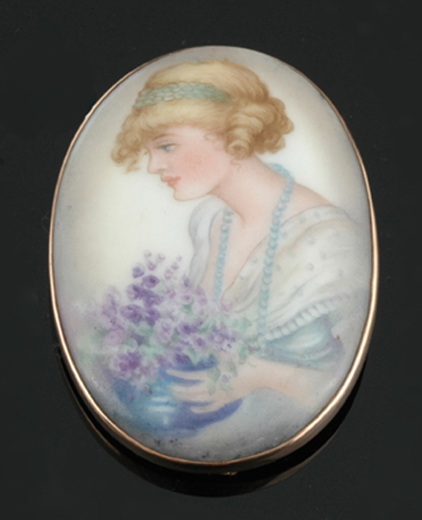 Appraisal: An Australian painted miniature brooch Depicting a lady in Edwardian