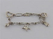 Appraisal: Tiffany Elsa Peretti collection a silver charm bracelet suspended with