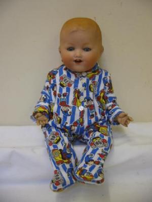 Appraisal: An Armand Marseille bisque head baby doll with grey blue