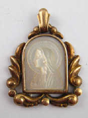 Appraisal: A mother of pearl cameo of Mary set in a