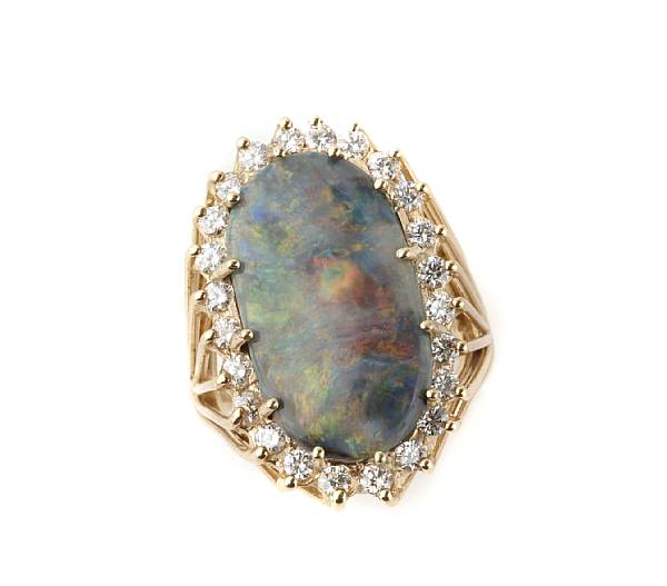 Appraisal: An oval opal diamond and k gold ring estimated total