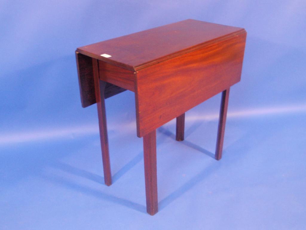 Appraisal: A Georgian mahogany drop leaf table on square moulded legs